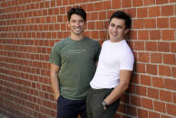 TikTok personalities Ian Paget, left, and Chris Olsen pose for a portrait in West Hollywood, Calif. on Oct. 20, 2020. Paget and Olsen, gay partners in Los Angeles, have amassed more than 4 million followers who love and encourage them as they hunker down at home, churning out goofy dance videos and playing the constant pranks that are stock-in-trade on TikTok. (AP Photo/Chris Pizzello)