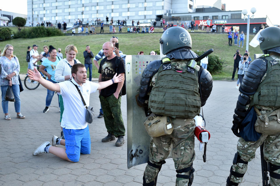 A man gestures in front of servicemen during an opposition protest in Minsk, Belarus, August 11, 2020. / Credit: SERGEI GAPON/AFP/Getty