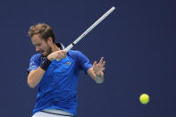 Daniil Medvedev returns a ball from Dominik Koepfer, of Germany, in their men's singles fourth round match at the Miami Open tennis tournament, Tuesday, March 26, 2024, in Miami Gardens, Fla. (AP Photo/Rebecca Blackwell)