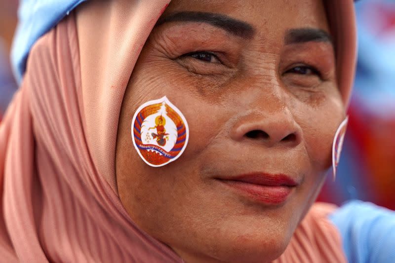 A supporter of Cambodia’s Prime Minister Hun Sen and Cambodian People’s Party attends an election campaign for the upcoming national election in Phnom Penh