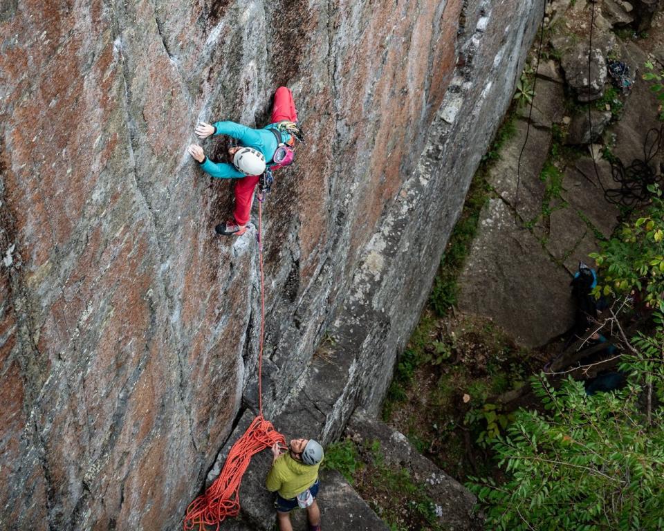 a group of people rock climbing