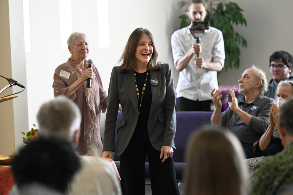 Democratic presidential candidate Marianne Williamson, center, is cheered by the crowd after finishing her talk at The Interfaith Center for Spiritual Growth, Sunday, Sept. 10, 2023, in Ann Arbor, Mich. “The most important things you do in life, not because there’s guaranteed success on some external level, but because you feel in your heart it’s the right thing to do,” Williamson, 71, said during an interview in New York City. (AP Photo/Jose Juarez)