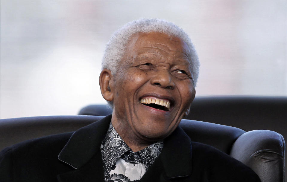 FILE - In this, Saturday, May 9, 2009 file photo, South Africa's former President Nelson Mandela smiles as newly appointed President Jacob Zuma makes his speech during his Inauguration in Pretoria, South Africa. The families of two women who have sought to be recognized as children of Nelson Mandela have contacted the executors of the will of the anti-apartheid leader, but are not seeking money, a lawyer said Monday, Feb. 10, 2014. (AP Photo/Themba Hadebe, Pool, File)