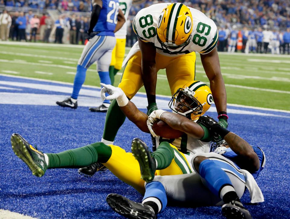 Geronimo Allison celebrates after catching a touchdown against Detroit at Ford Field on Jan. 1, 2017.