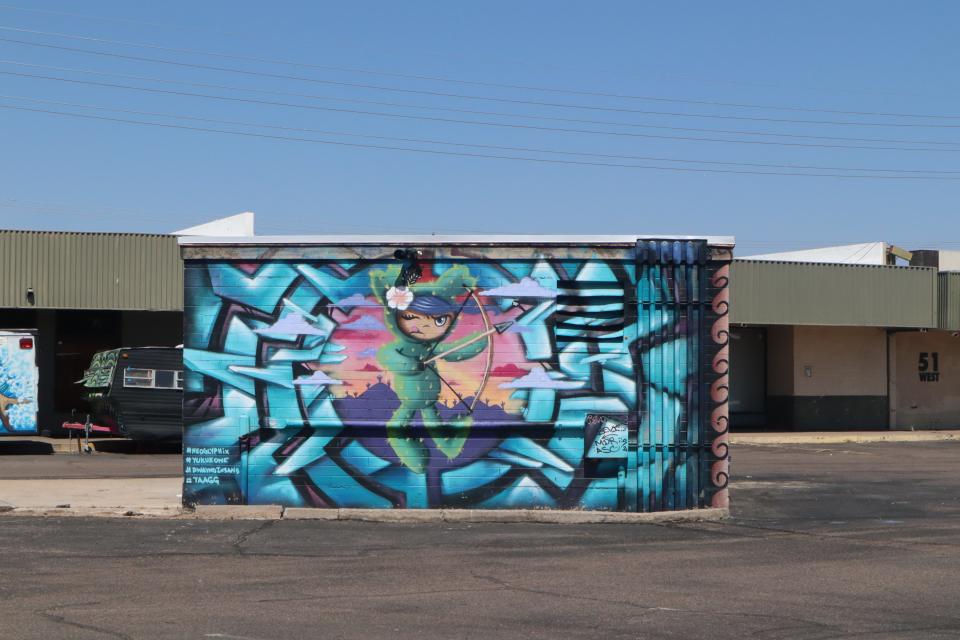 A mural painted by a collective of Indigenous artists in Danelle Plaza.