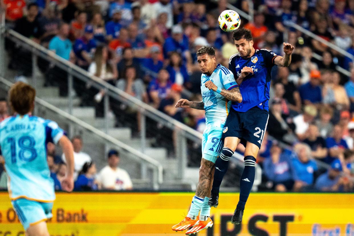 FC Cincinnati defender Matt Miazga (21) heads the ball as Colorado Rapids forward Rafael Navarro (9) competes for it in the second half of the MLS match between the FC Cincinnati and the Colorado Rapids at TQL Stadium in Cincinnati on Saturday, April 27, 2024.