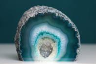 <p><strong>State Rock: Geode </strong></p><p>These rocks, which have beautiful and colorful quartz designs inside, were made the <a href="http://publications.iowa.gov/135/1/profile/8-1.html" rel="nofollow noopener" target="_blank" data-ylk="slk:state rock in 1967;elm:context_link;itc:0;sec:content-canvas" class="link ">state rock in 1967</a>. </p>