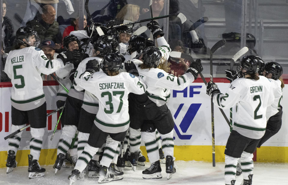 Boston celebrates a win over Montreal during the third overtime of a PWHL playoff hockey game in Laval, Quebec, Saturday, May 11, 2024. (Christinne Muschi/The Canadian Press via AP)