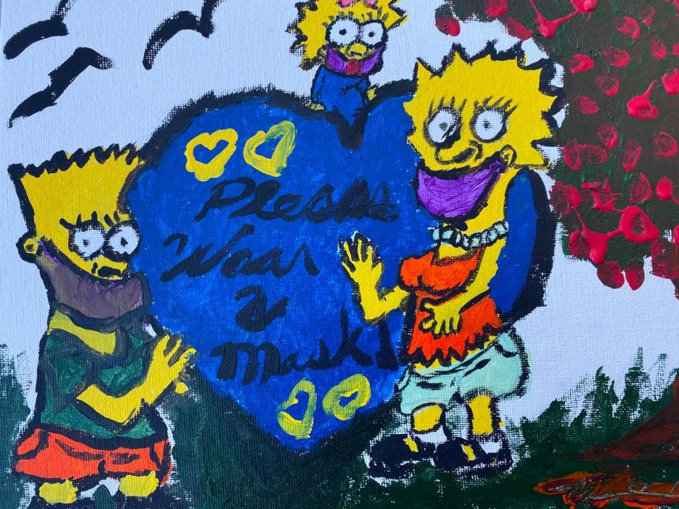 Monique Moore’s painting of “The Simpsons” cartoon family depicts a heart with the words “Please Wear a Mask,” and came to her as a statement about COVID-19.