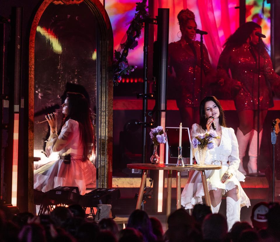 Lana Del Rey sits at vanity during performance at FirstBank Amphitheater on Thursday, Sept. 14, 2023.