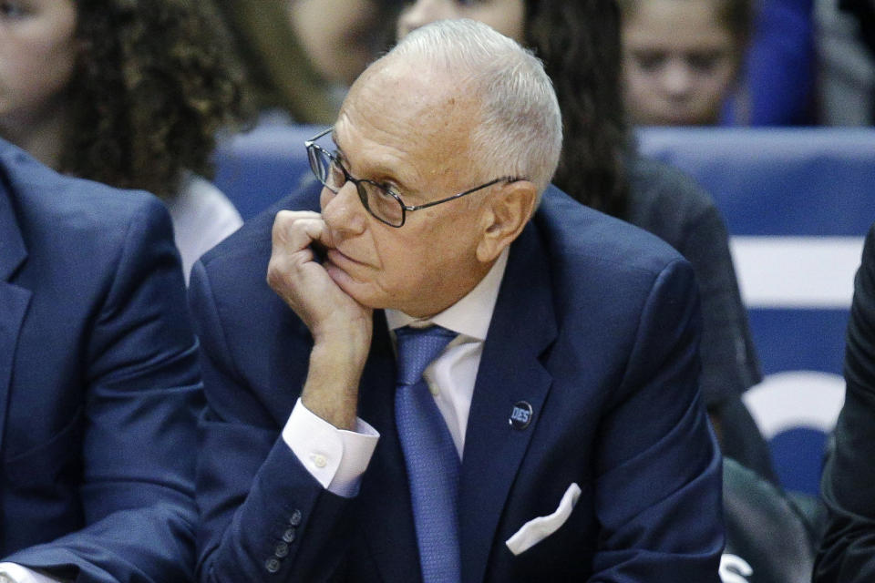 FILE - In this March 6, 2016, file photo, SMU head coach Larry Brown watches his players from the bench during the first half of an NCAA college basketball game against Cincinnati in Cincinnati. Memphis coach Penny Hardaway has added Hall of Famer Larry Brown to the Tigers’ staff as an assistant, reuniting the former New York Knicks player and coach. (AP Photo/John Minchillo, File)
