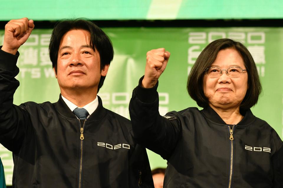 Taiwan President Tsai Ing-wen (R) and Vice President-elect William Lai (L) gesture outside the campaign headquarters in Taipei on January 11, 2020. - President Tsai Ing-wen declared victory in Taiwan's election on January 11 as votes were being counted after an election battle dominated by the democratic island's fraught relationship with China. (Photo by Sam Yeh / AFP) (Photo by SAM YEH/AFP via Getty Images)