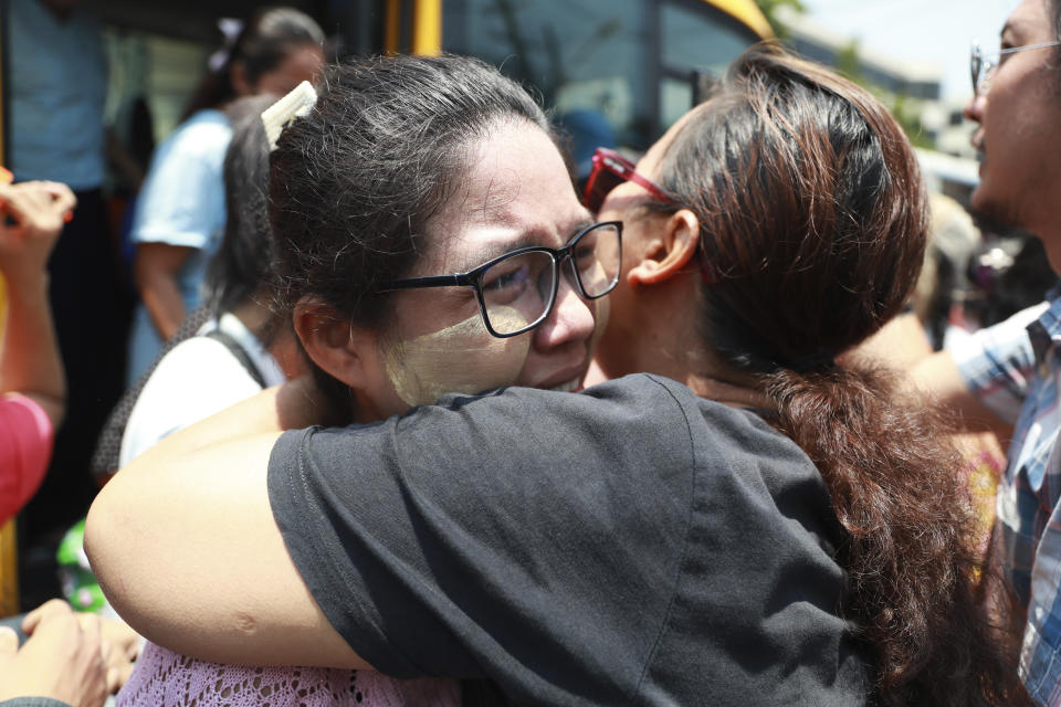 A released prisoner is welcomed by family members and colleagues after she was released from Insein Prison Wednesday, April 17, 2024, in Yangon, Myanmar. On Wednesday Myanmar's military government granted amnesty for over 3,000 prisoners to mark this week’s traditional New Year holiday. (AP Photo/Thein Zaw)