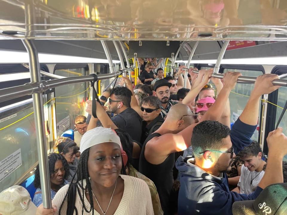 Marie Jean, in the foreground to the left, said she struggled to stand during her trip on Miami-Dade Couty bus No. 120 between South Beach and downtown Miami on Wednesday, March 1, 2023.