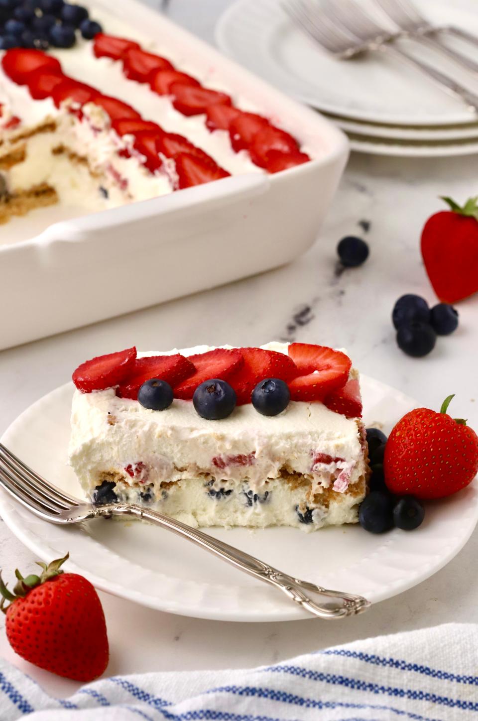 No-bake cake with whipped cream, graham crackers,  strawberries and blueberries is perfect for July Fourth.