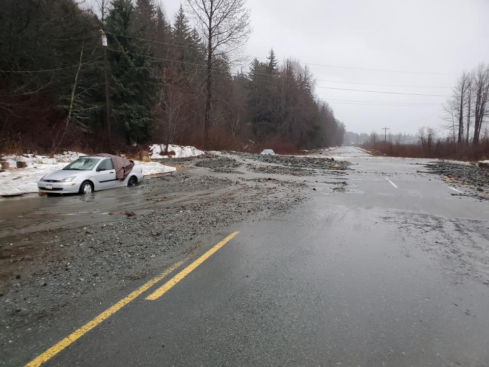 This photo provided by the Alaska Department of Transportation and Public Facilities shows damage from heavy rains and a mudslide 600 feet wide in Haines, Alaska, on Wednesday, Dec. 2, 2020. Authorities say six people are unaccounted for, and four homes were destroyed in the slide, with the search resuming Thursday morning for survivors. (Matt Boron/Alaska Department of Transportation and Public Facilities via AP)