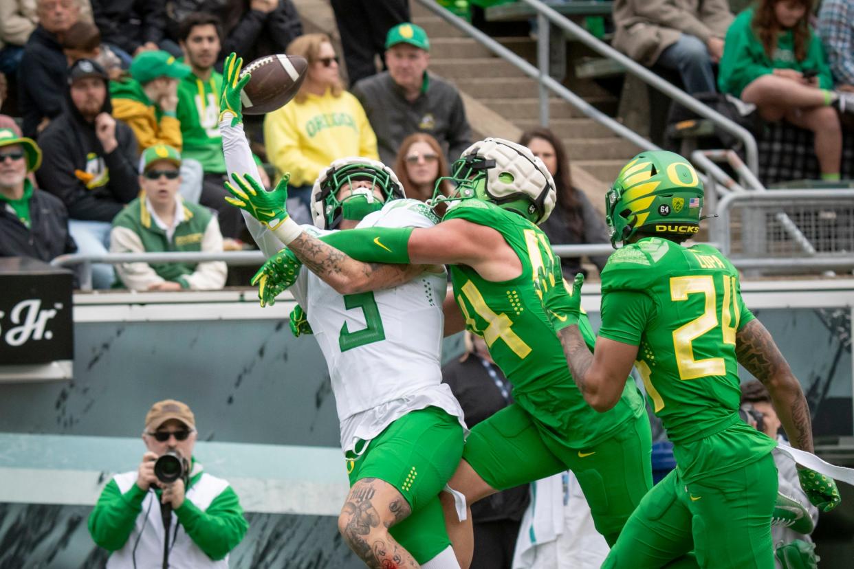 Oregon Green Team offensive linebacker Teitum Tuioti breaks up a pass intended for White Team tight end Terrance Ferguson during the Oregon Ducks’ Spring Game Saturday, April 27. 2024 at Autzen Stadium in Eugene, Ore.