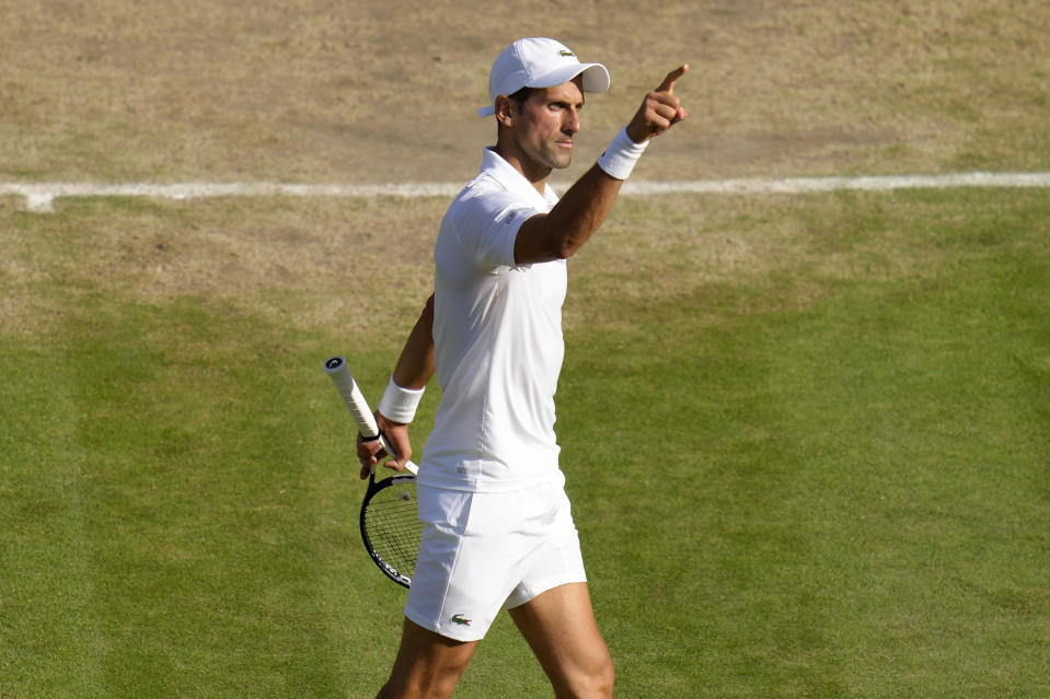 Serbia's Novak Djokovic reacts as he plays Britain's Cameron Norrie in a men's singles semifinal on day twelve of the Wimbledon tennis championships in London, Friday, July 8, 2022. (AP Photo/Kirsty Wigglesworth)