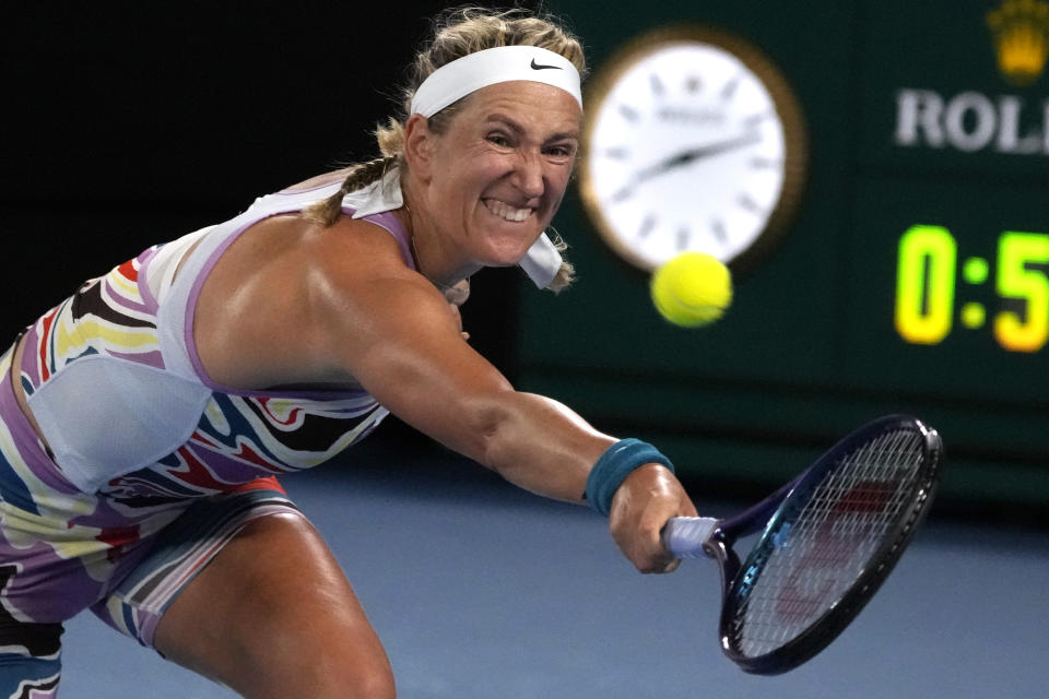 Victoria Azarenka of Belarus plays a backhand return to Jessica Pegula of the U.S. during their quarterfinal match at the Australian Open tennis championship in Melbourne, Australia, Tuesday, Jan. 24, 2023. (AP Photo/Ng Han Guan)