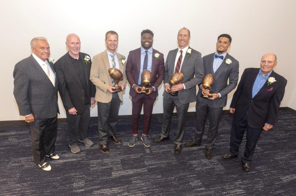 The 2023 Stark County High School Football Hall of Fame class from left, Ron Carnahan, Keith Wakefield, Bobby Hendry, Dymonte Thomas, Steve Smith, Devin Smith, and Ron Worstell. 