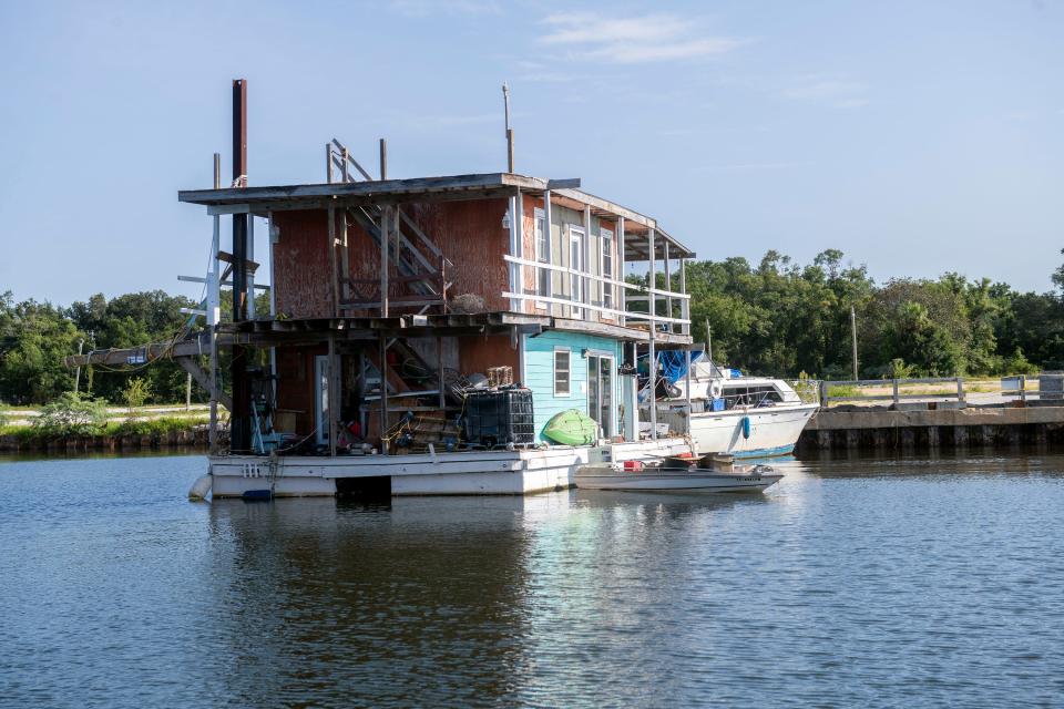 Two Story Houseboat Runs Aground On Bayou Chico Taxpayers May End Up   De62d87a1c2d6bccea9fe0ef99e16a37