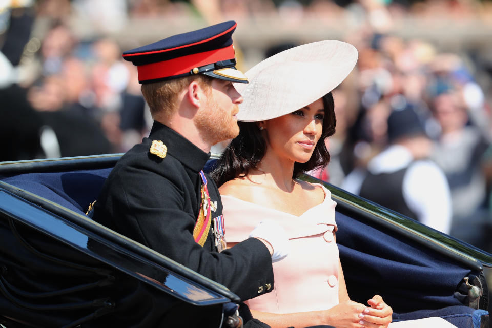 <p>Meghan Markle was also in attendance and made her first public appearance post honeymoon. She wore a custom Carolina Herrera dress with the same Philip Treacy hat she donned at the Buckingham Palace Garden party last month. Meanwhile Prince Harry wore his Blues and Royals uniform. Photo: Getty </p>