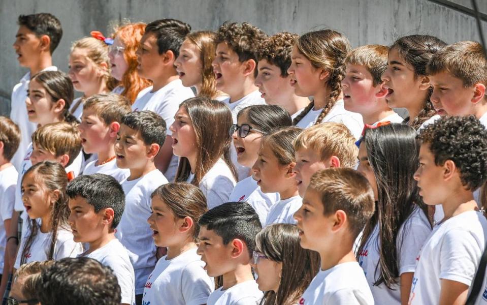 Children from the Charlie Keyan Armenian Community School sing traditional Armenian songs during the annual Armenian Flag Raising Ceremony outside Fresno City Hall on Monday, April 24, 2023.