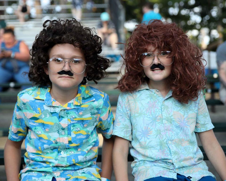 A couple of young "Weird Al" Yankovic fans muster their best costumed impersonations of the comedic parody singer-songwriter, complete with wigs, mustaches, glasses and Hawaiian shirts, during his performance Friday at Indian Ranch in Webster.