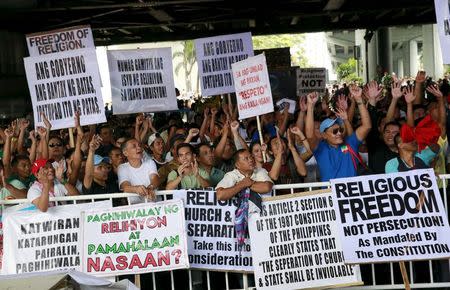 Filipino members of the Iglesia ni Cristo (Church of Christ) or INC display signs during a protest in Manila August 29, 2015. REUTERS/Romeo Ranoco