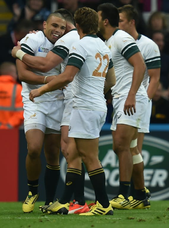 South Africa's wing Bryan Habana (L) celebrates with teammates after scoring a try during a Pool B match of the 2015 Rugby World Cup against Scotland at St James' Park in Newcastle-upon-Tyne, north east England on October 3, 2015