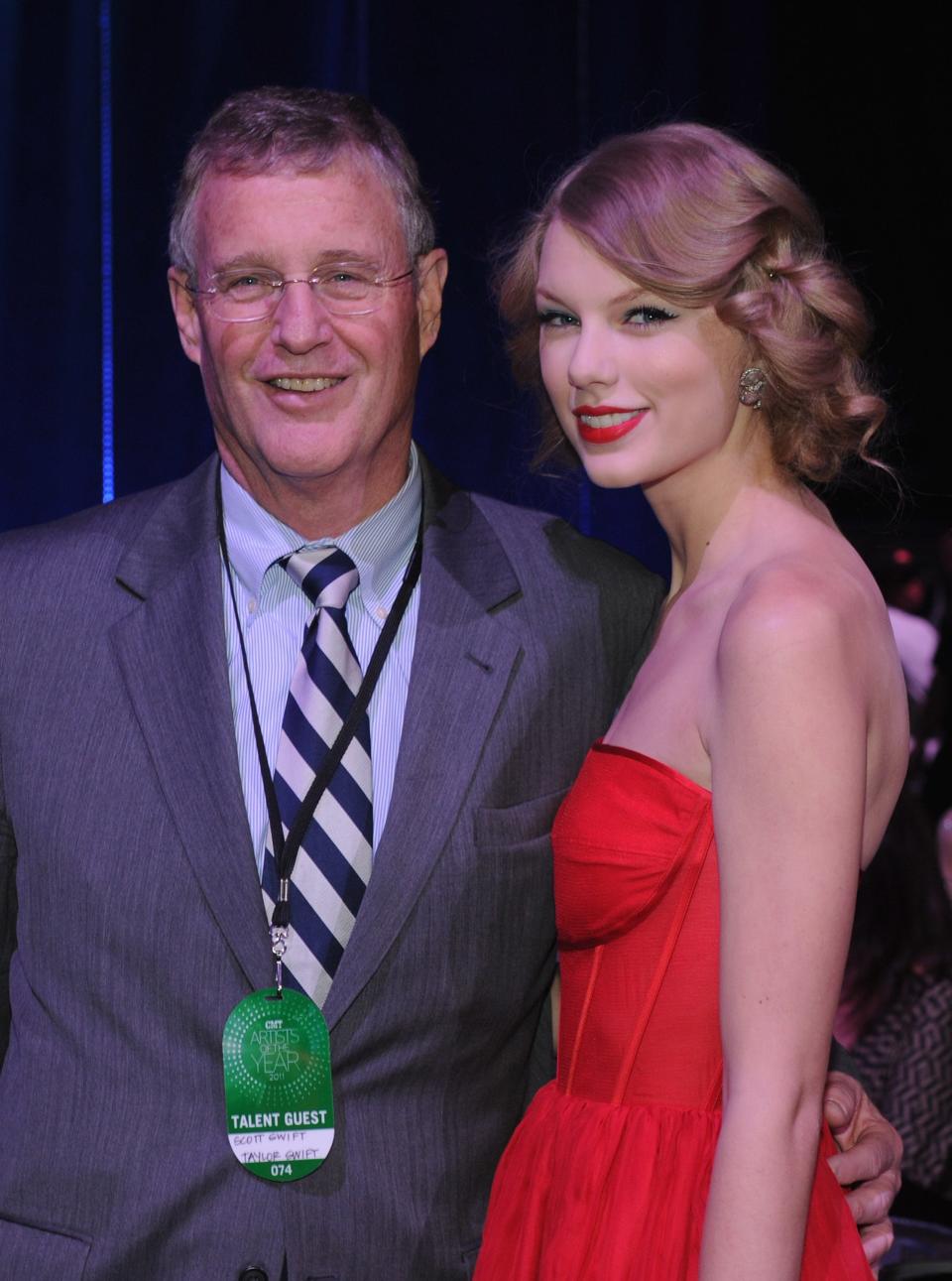 Scott K. Swift and  daughter Taylor Swift at the 2011 CMT Artists of the Year celebration at the Bridgestone Arena on November 29, 2011 in Nashville, Tennessee.