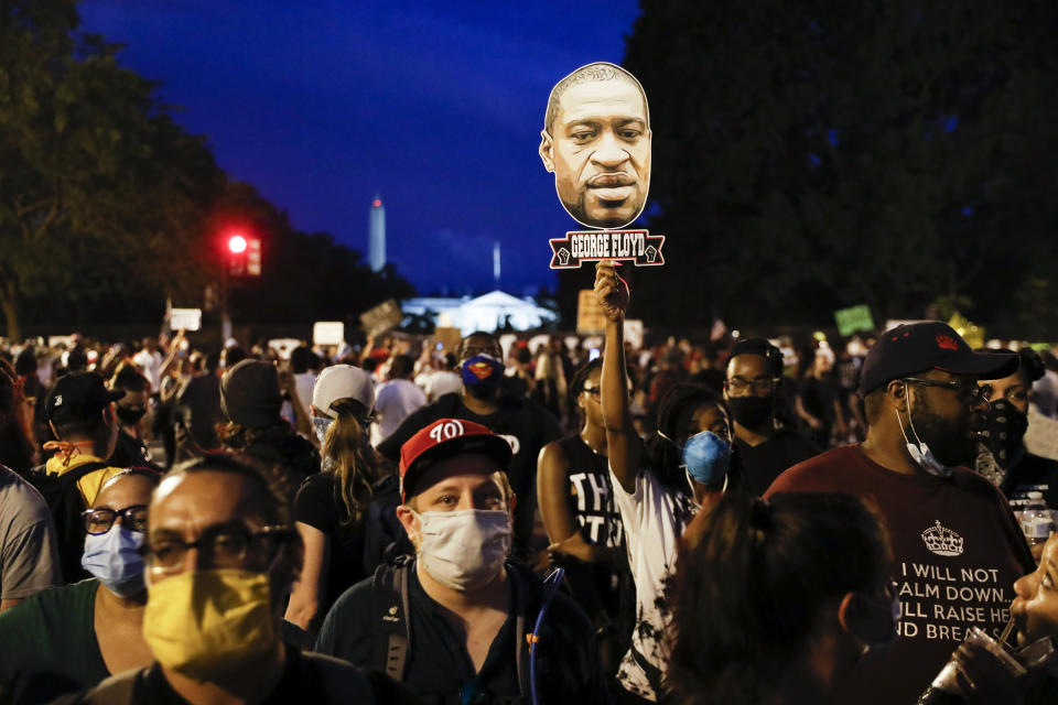 Demonstrators protest Saturday, June 6, 2020, near the White House in Washington, over the death of George Floyd, a black man who was in police custody in Minneapolis. Floyd died after being restrained by Minneapolis police officers. (AP Photo/Jacquelyn Martin)