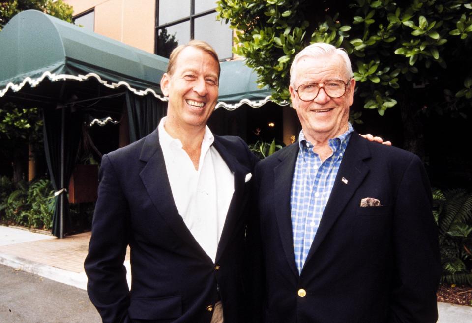 Mike McCarty, left, with George Dempsey in front of the restaurant that McCarty acquired in 2002. McCarty opened his namesake restaurant in the space.