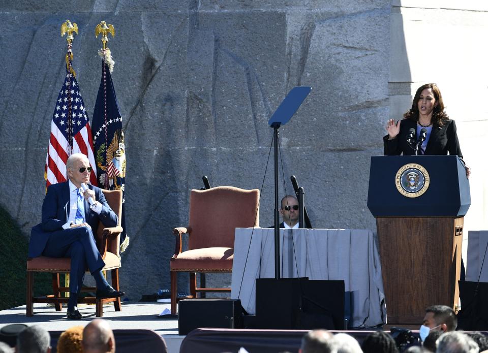 Vice President Kamala Harris speaks as President Joe Biden looks on during a ceremony marking the 10th Anniversary dedication of the Martin Luther King, Jr., Memorial, in Washington, DC, on Oct. 21, 2021.