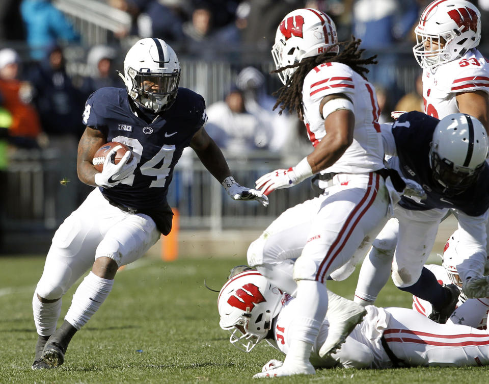 Penn State's Miles Sanders (24) runs the ball against Wisconsin during the first half of an NCAA college football game in State College, Pa., Saturday, Nov. 10, 2018. (AP Photo/Chris Knight)