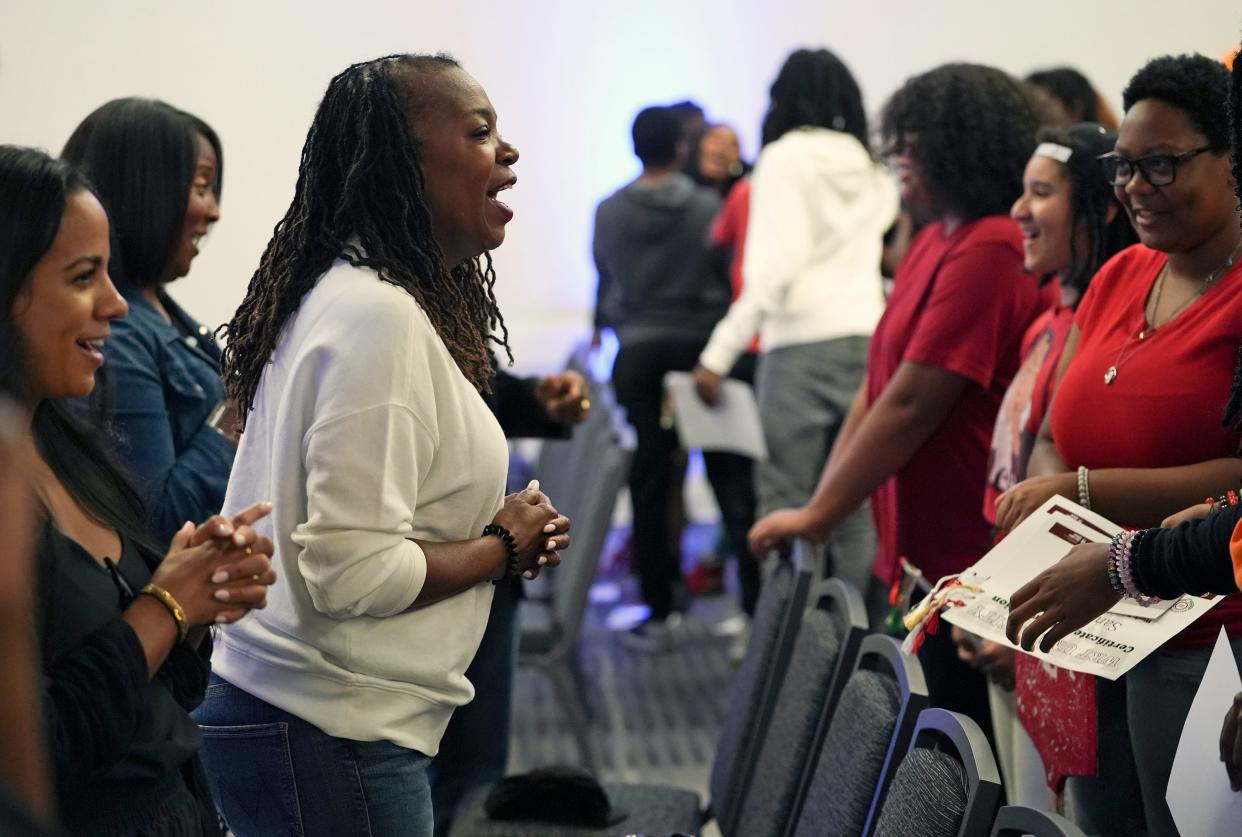 Columbus Urban League CEO Stephanie Hightower cheers with a group of students during their graduation ceremony as part of the WRT University Career & CULture Experience summer program. The Urban League is among several groups and government agencies over the past few years to declare racism a public health crisis.