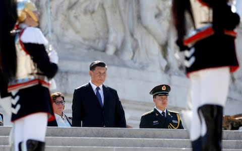 Chinese President Xi Jinping attends a ceremony at the Tomb of the Unknown Soldier in Rome's Piazza Venezia - Credit: Reuters