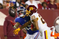 Washington Football Team cornerback Kendall Fuller (29) stops New York Giants wide receiver Kenny Golladay (19) from catching the ball during the second half of an NFL football game, Thursday, Sept. 16, 2021, in Landover, Md. (AP Photo/Alex Brandon)