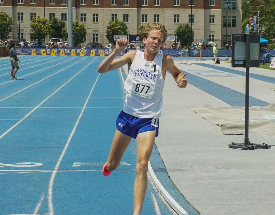 Covington Catholic sophomore Will Sheets celebrates after winning the boys 3,200 meters at the KHSAA Class 3A track and field championships at the University of Kentucky on June 3, 2023. Sheets ran a time of 9:16.81 for the win.
