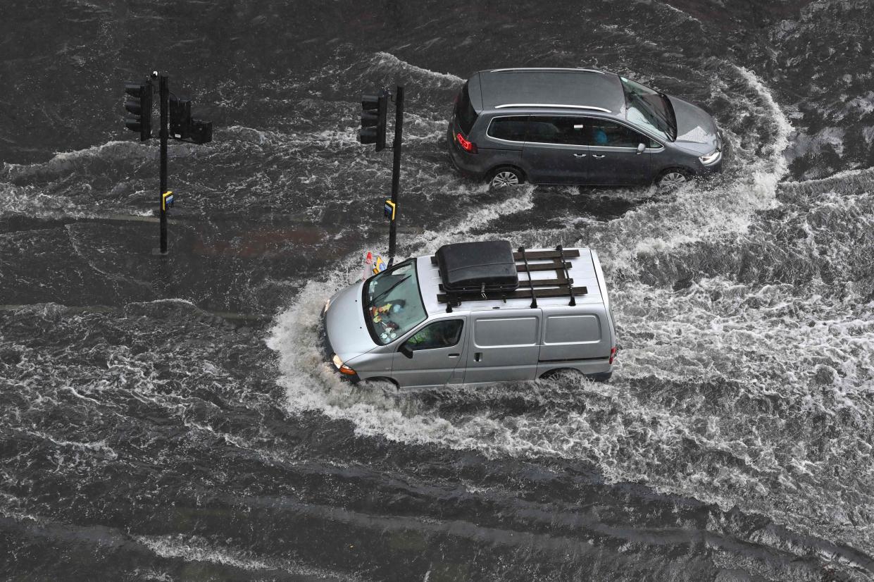 A flooded road in Nine Elms , London, on Suunday after extreme heat triggered torrential rain (AFP via Getty Images)