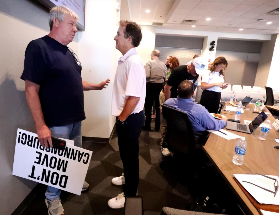 Tom Padgett, left speaks with the Murfreesboro Mayor Shane McFarland after during a break in the meeting of the Murfreesboro City Council on Thursday, Sept. 14, 2023, where a new minor league baseball stadium and team coming to Murfreesboro was discussed.