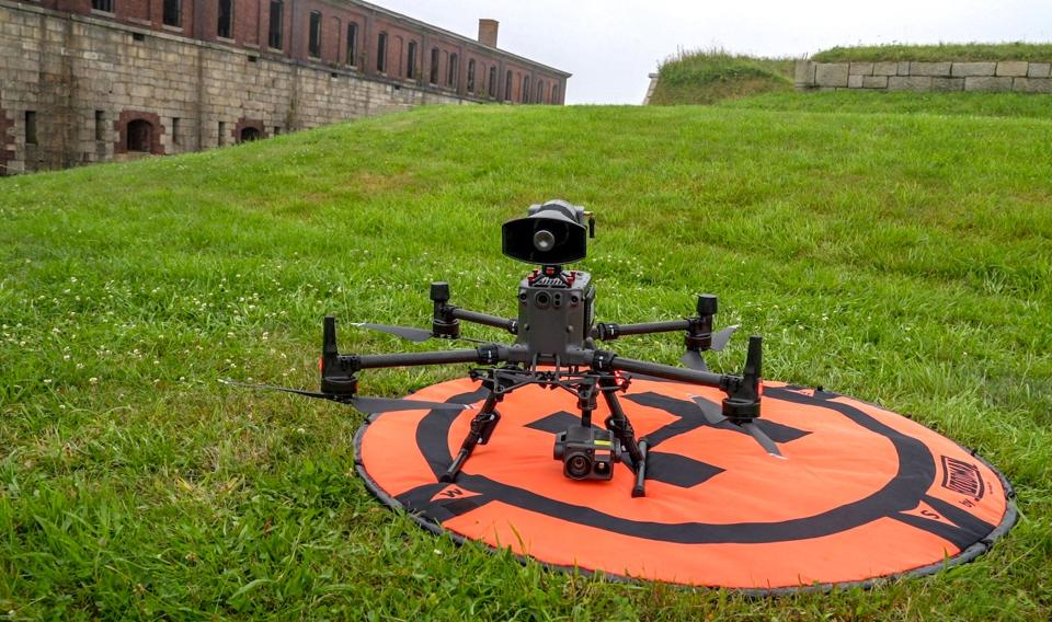 A Rhode Island State Police drone, equipped with sophisticated cameras and a megaphone, sits on a small helipad during a security drill at Fort Adams in Newport.