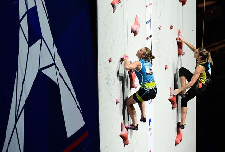 Speed climbers on wall.