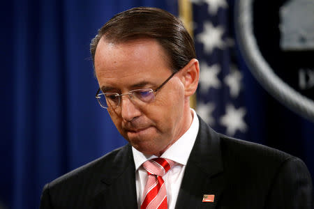 FILE PHOTO: Deputy U.S. Attorney General Rod Rosenstein pauses while announcing grand jury indictments of 12 Russian intelligence officers in special counsel Robert Mueller's Russia investigation, during a news conference at the Justice Department in Washington, U.S., July 13, 2018. REUTERS/Leah Millis/File Photo