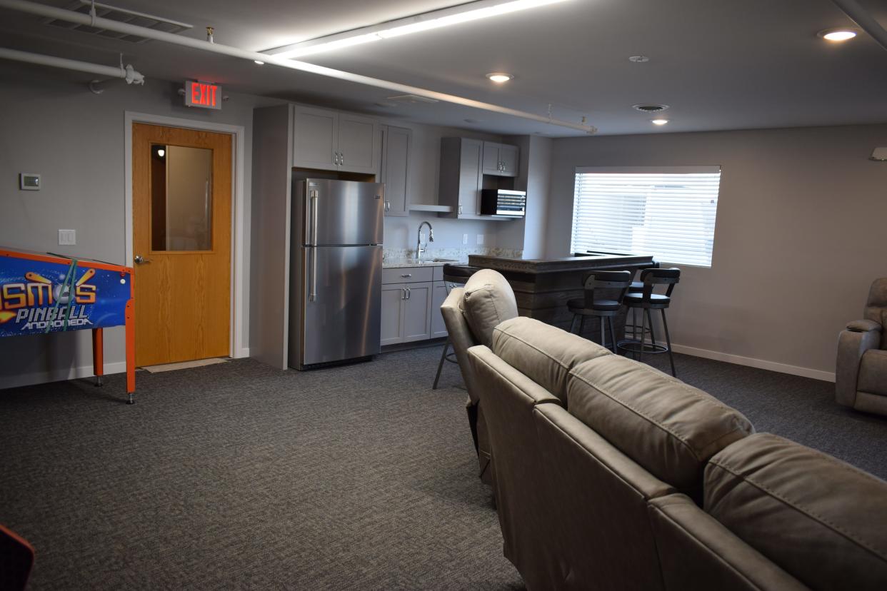 The renovated space includes a seating area with two arcades, a pool table, a full kitchen and everything else needed for young men aging our of foster care.