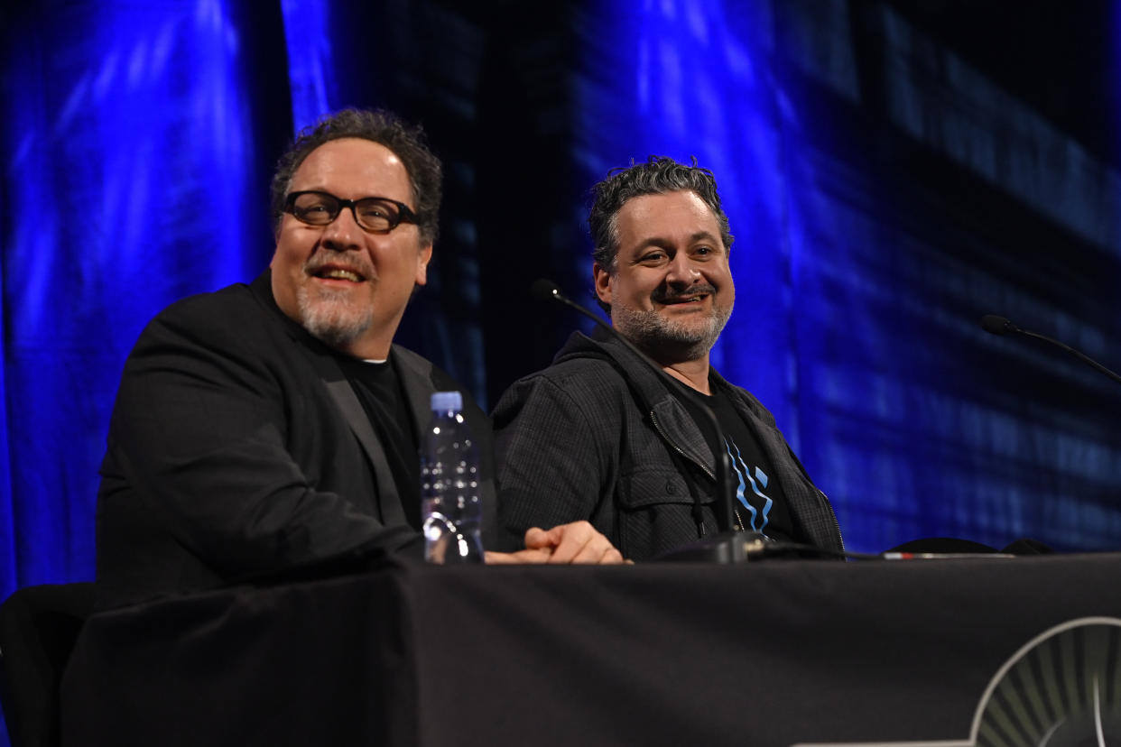 LONDON, ENGLAND - APRIL 08: John Favreau and Dave Filoni onstage during the Ahsoka panel at the Star Wars Celebration 2023 in London at ExCel on April 08, 2023 in London, England. (Photo by Kate Green/Getty Images for Disney)