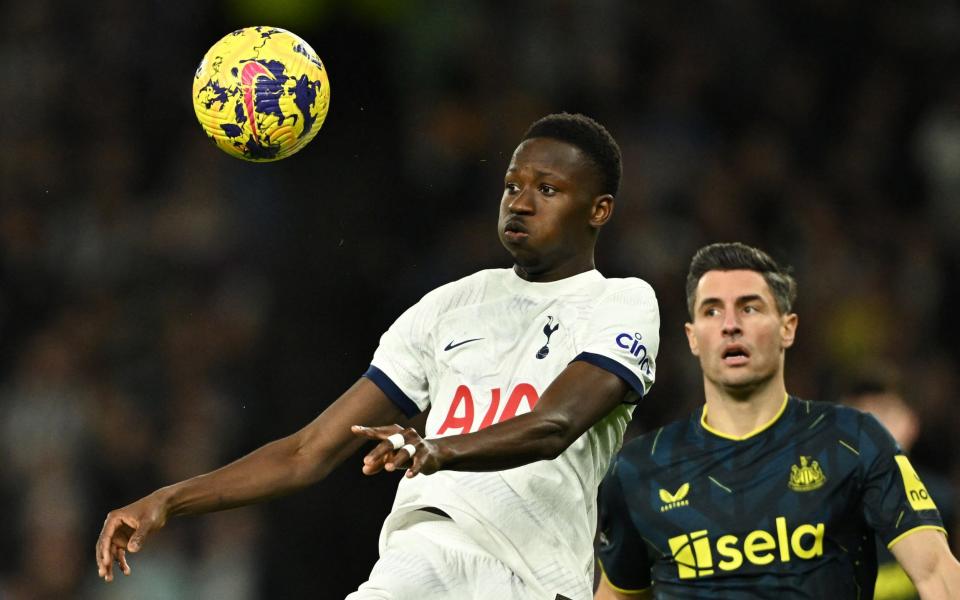 Tottenham Hotspur's Pape Matar Sarr in action with Newcastle United's Fabian Schar
