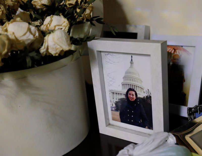 Portrait of Ratih Purwarini, a doctor who passed away due to the coronavirus disease (COVID-19), is displayed next to flowers at her parents' house in Jakarta