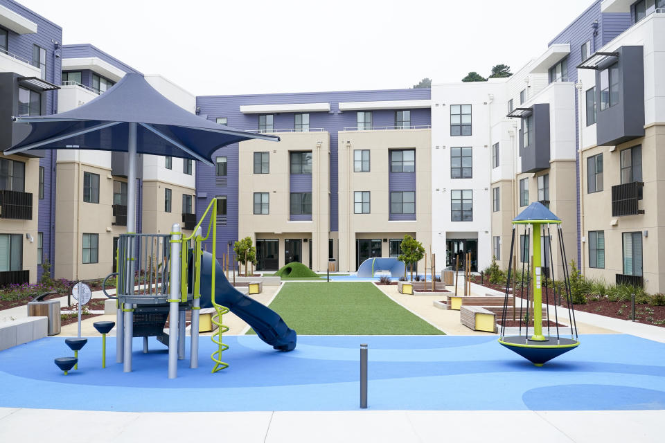 A children's playground is part of the courtyard of a new housing complex for Jefferson Union High School District teachers and education staff, in Daly City, Calif., Friday, July 8, 2022. The school district in San Mateo County is among just a handful of places in the country with educator housing. But with a national teacher shortage and rapidly rising rents, the working class district could serve as a harbinger as schools across the U.S. seek to attract and retain educators. (AP Photo/Godofredo A. Vásquez)