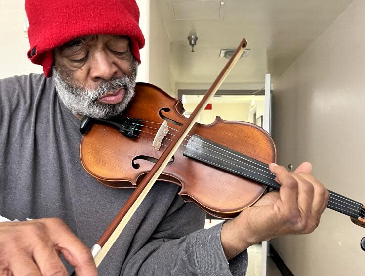 Nathaniel Ayers played violin, cello and piano to keep busy during a brief stint in the hospital